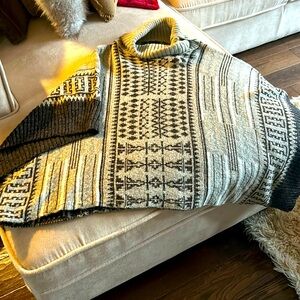 Boho poncho, great look with jeans and boots!  Cute wooden button neck detail.